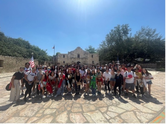 students standing in front of the Alamo