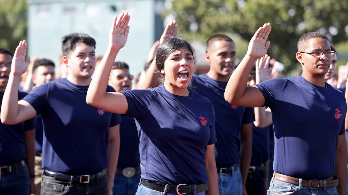 New military enlistees raising  their right hands and being sworn-in 
