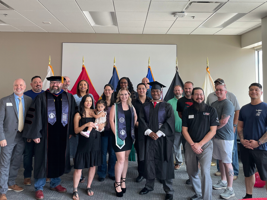 Student Veteran Graduates Posing for Picture