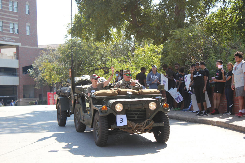 Historical 1970s military jeep with Dr. Kathleen Light, parade Grand Marshall