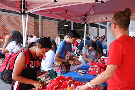 Students at a table at the National Night Out event