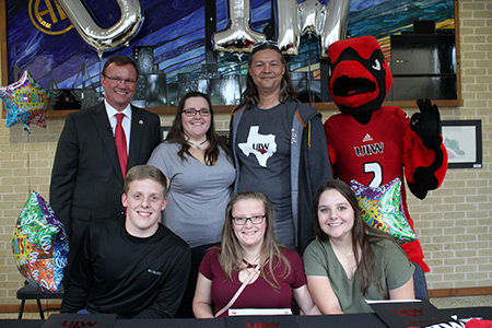 Matthew, Melanie and Madelyn Peters, L-R Back Row, Dr. Thomas Evans, Karyn Peters, Paul Harris and Red the Cardinal