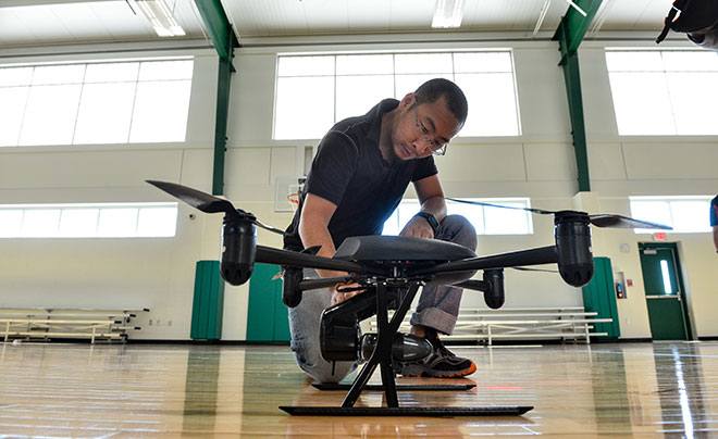 man working on a drone