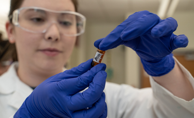 UIW student checks a bottle