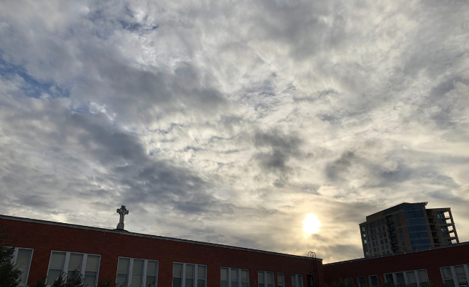 Cross against a cloudy sky