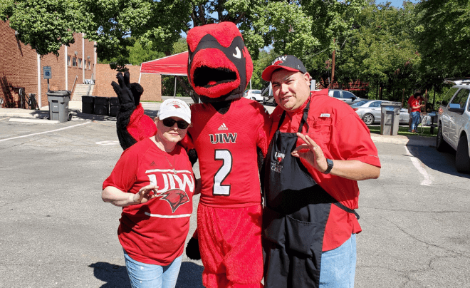 Dr. Chris Alvarado grilling at a UIW football game tailgate