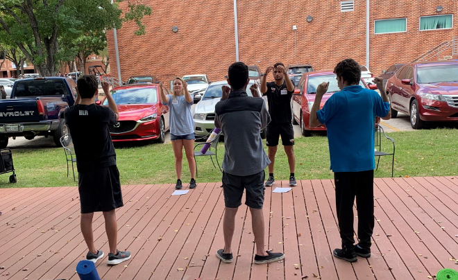 Warren Fulgenzi leading exercises for people in NETS