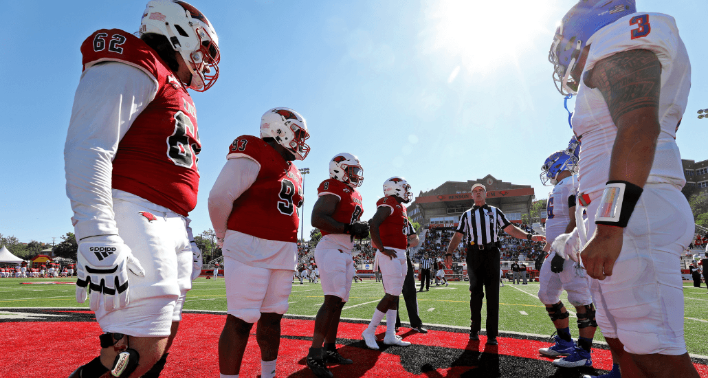 UIW football participates in pregame coin toss with Houston Baptist