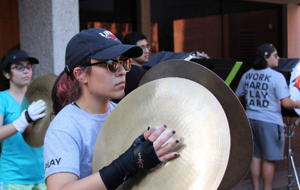 Ambar Valtierra playing cymbals