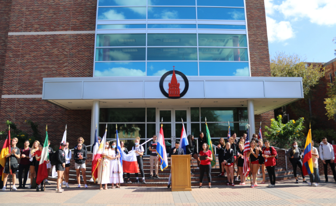 Students holding flags following the Parade of Flags