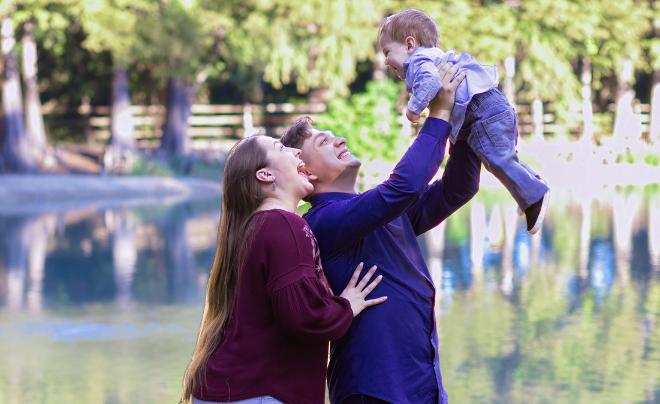 Michael Lesley and wife Brittany play with their son