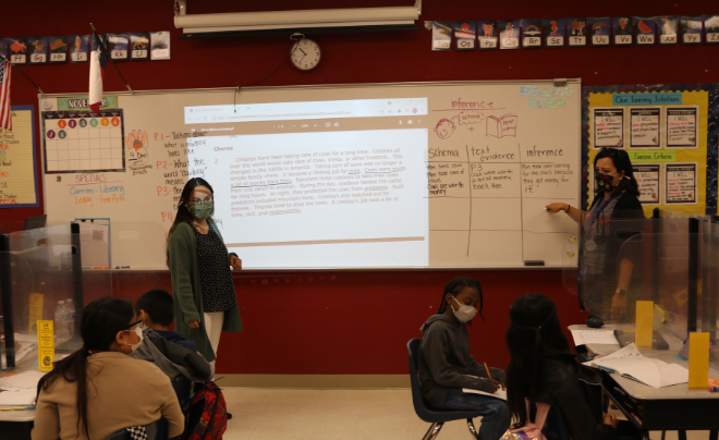 Ashley De La O and Joanna Fuchs Carreon teach a class