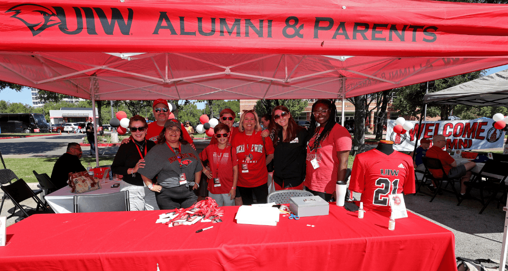 People posing at the RedZone Cardinal Tailgate