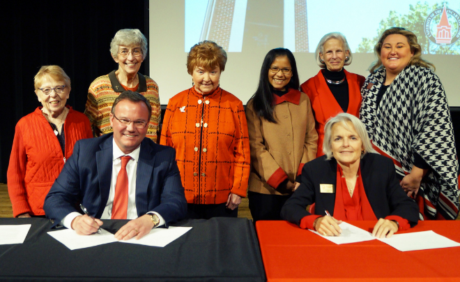 Dr. Thomas M. Evans, Sr. Kathleen Coughlin and additional CCVI members pose for a picture