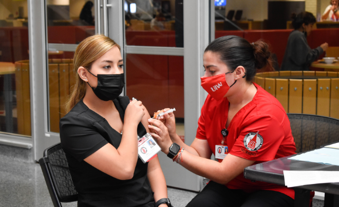 UIW nurse administers vaccine