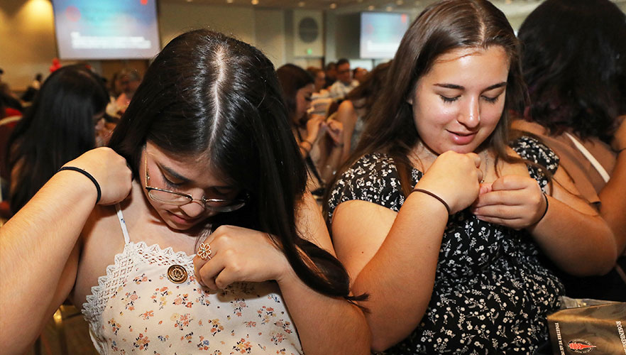 Students pinning to clothes