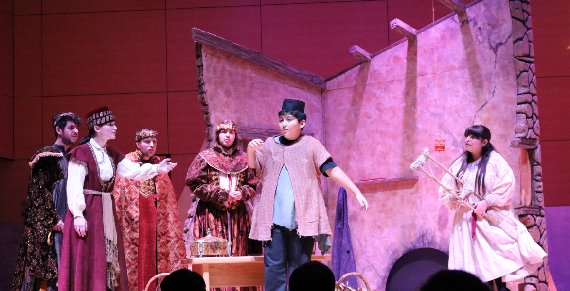 Amahl with the three kings and his mother in the background