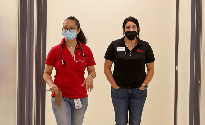 Yesenia Anaya and fellow student walking