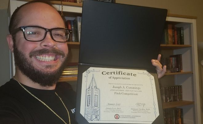 Austin Cummings with his award