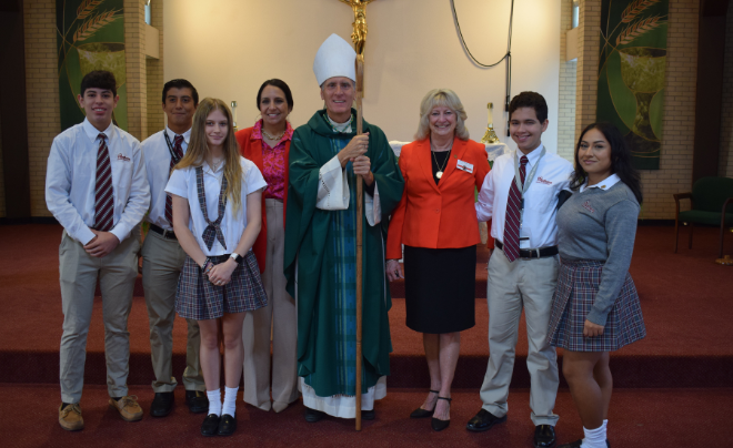 Auxiliary Bishop Gary Janak and members of St. 