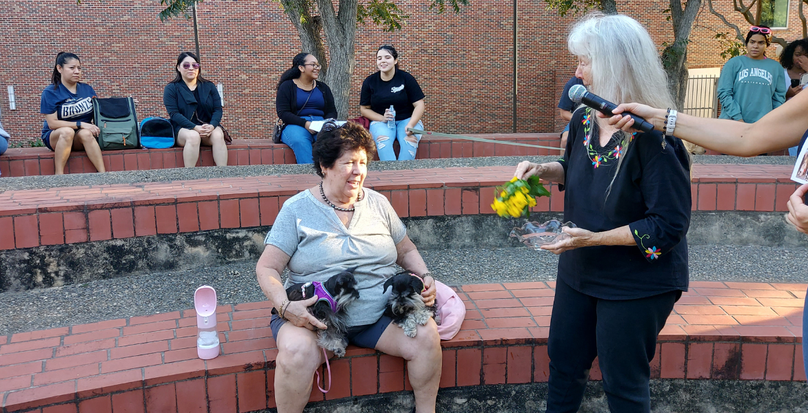 Sister Martha Ann Kirk blessing two dogs