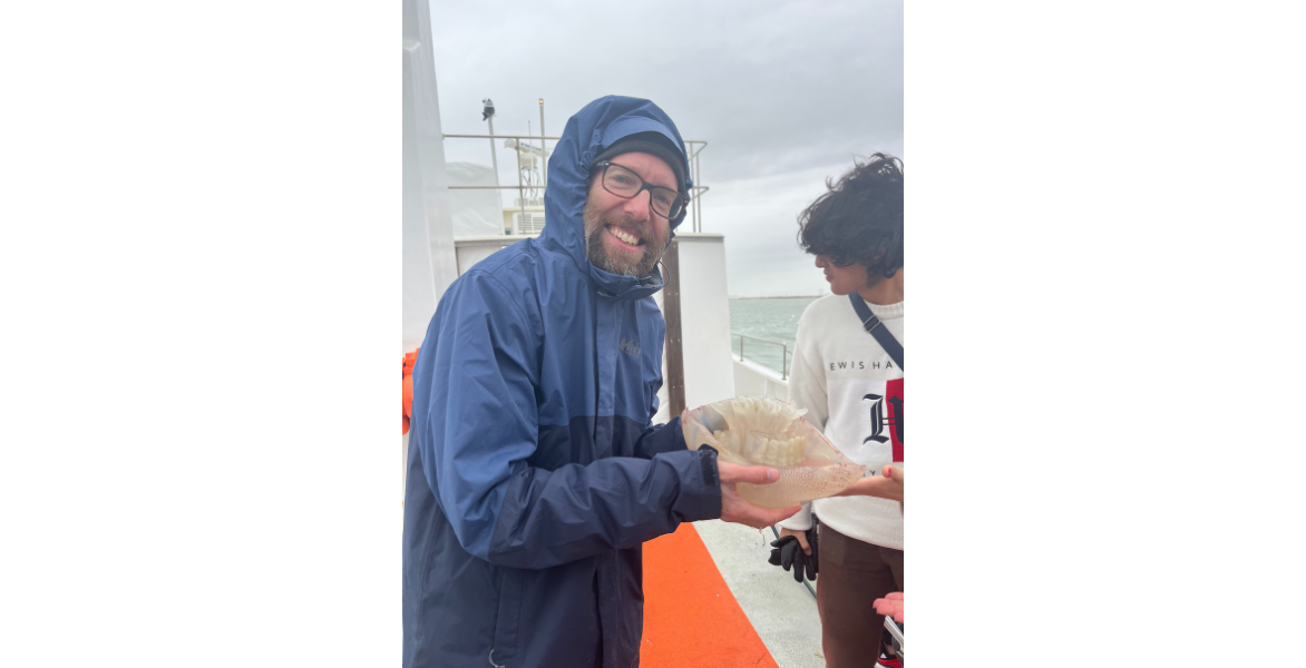 Dr. John Hooker holding a jellyfish