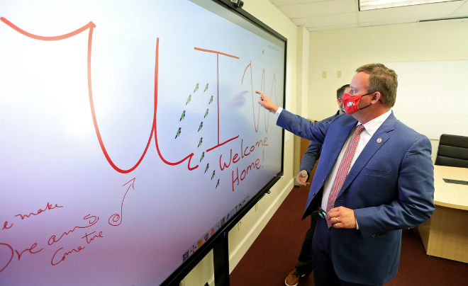 Dr. Thomas M. Evans, UIW president, displays new technology in a classroom