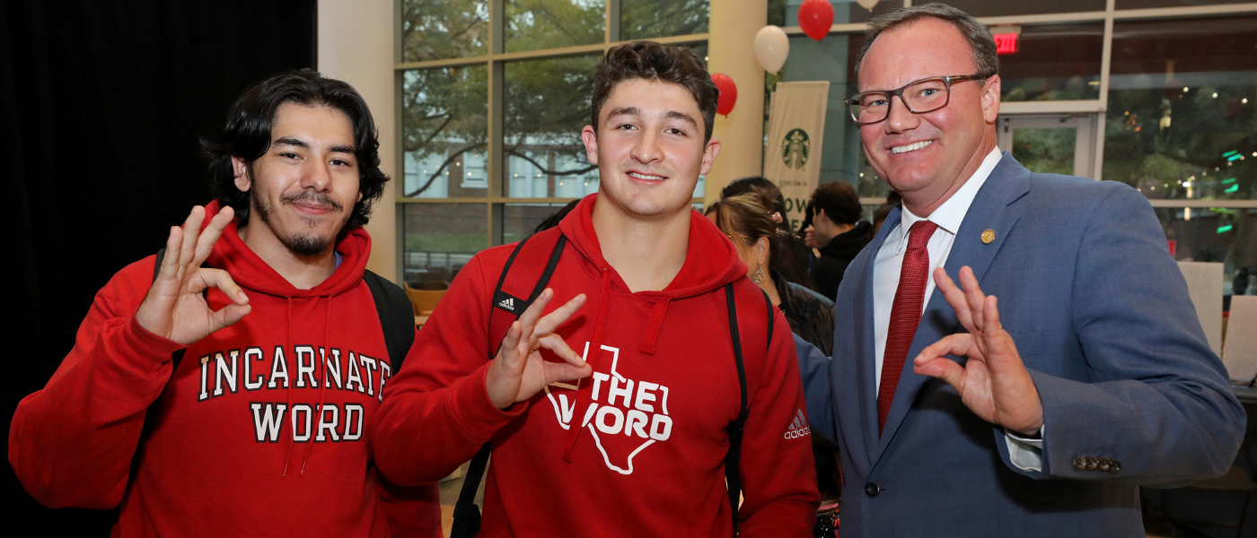 Two UIW students and Dr. Thomas M. Evans, PhD