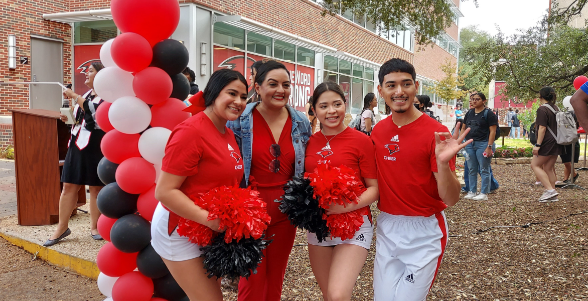 Samantha Najera poses with members of UIW cheer team