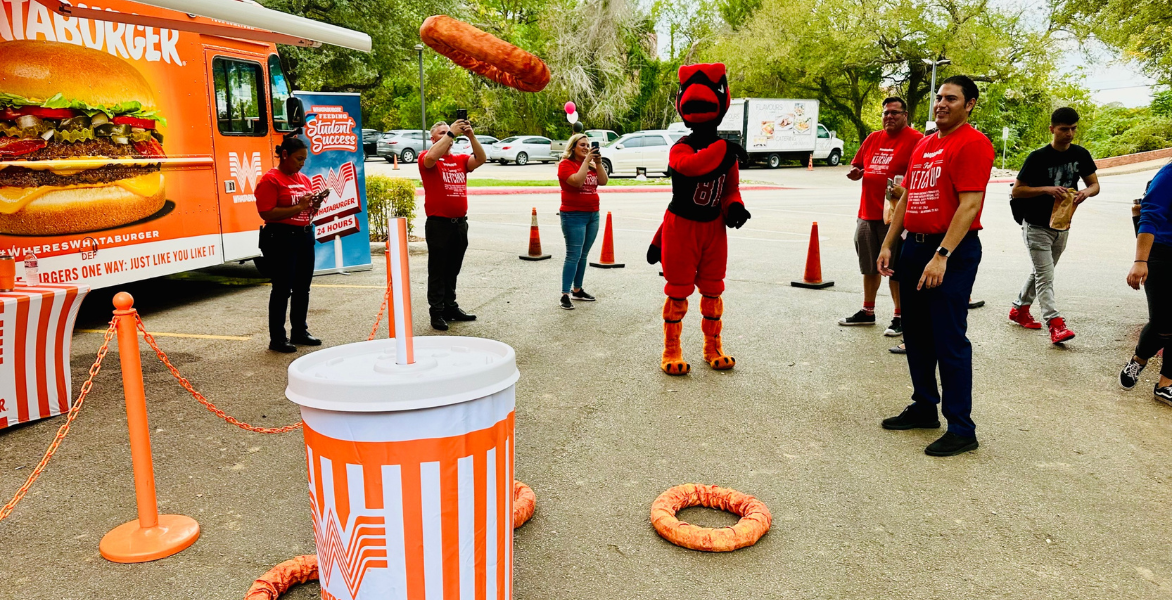 Red tosses a giant fake onion ring