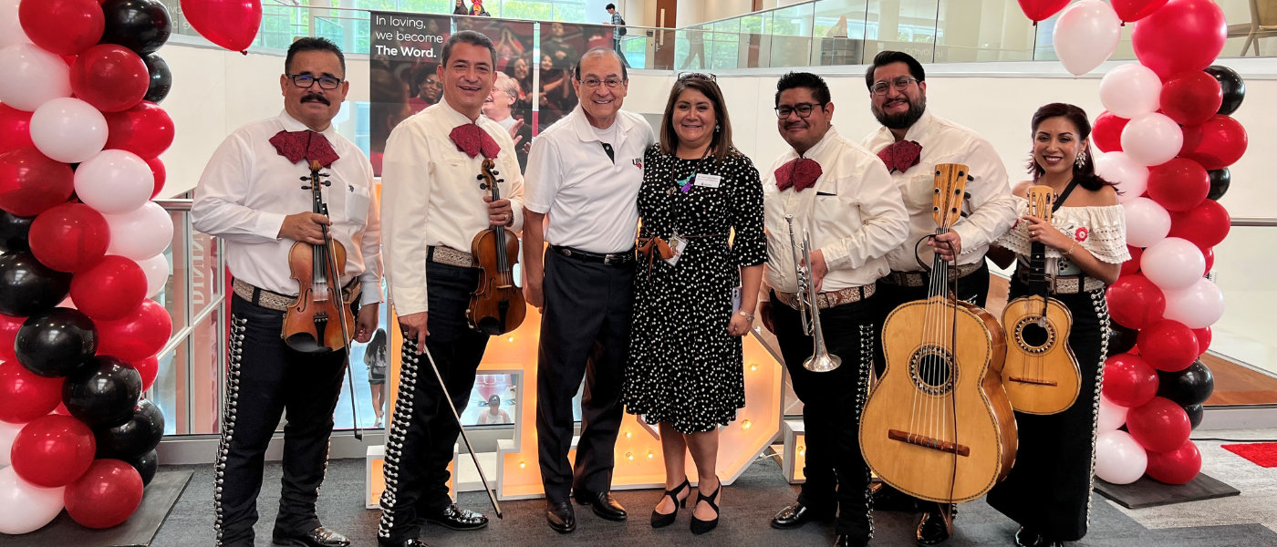 Dr. Carlos Garcia (third from left), Monica Jimenez, and a Mariachi band