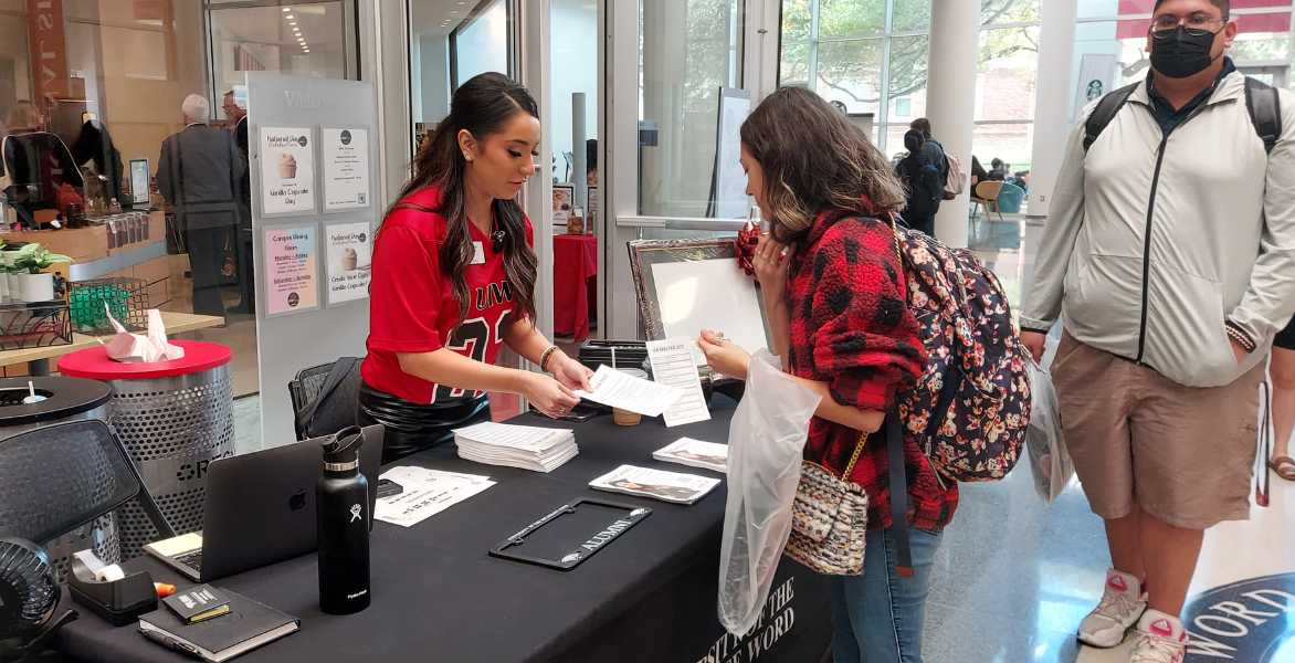 Graduating student checks in at graduation fair