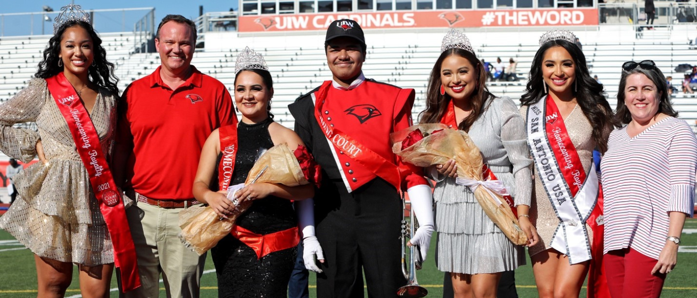 Homecoming court: (L-R) Tiana DeVaughn, UIW President Dr. Thomas M. Evans, Brianna Rivera, Thomas Hill, Julianna Sandoval, Abigail Velez, Mrs. Lisa Evans