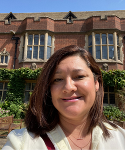 Dr. Debora Kaliski in front of her dorm at Cambridge