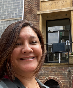 Dr. Debora Kaliski in front of the anatomy building at Cambridge