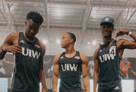 Kyle Lewis and teammates pose at a track meet