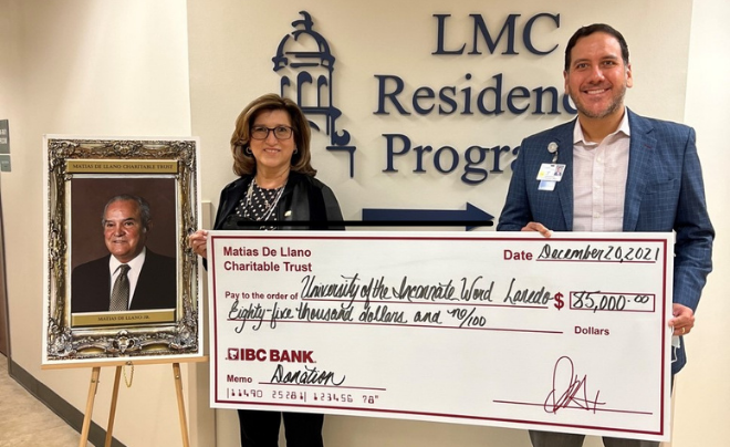 (L-R): Eliza Gonzalez, IBC VP and Jorge Leal, CEO of LMC standing next to photo of Matias De Llano