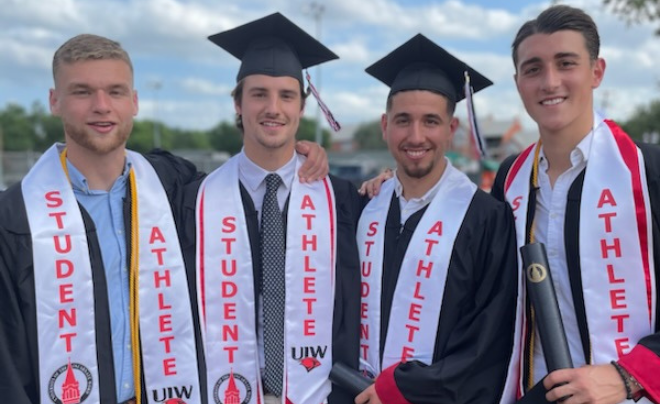 Lars Willems (far right) and three student-athletes after graduation