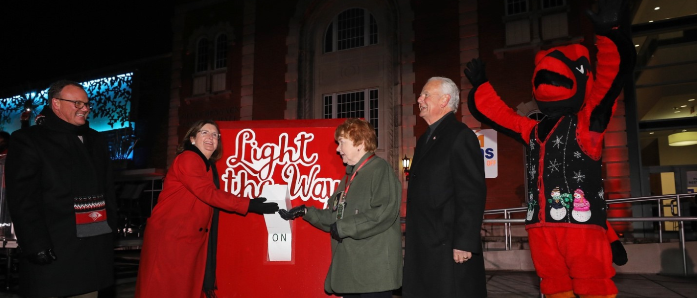 (L-R) – Dr. Thomas M. Evans, Suzanne Goudge, Sr. Kathleen Coughlin, Charlie Lutz and UIW mascot Red the Cardinal flip the switch for Light the Way