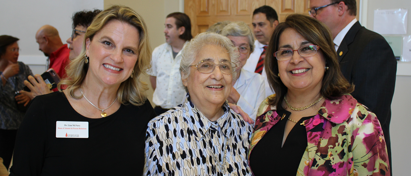 Three women smiling