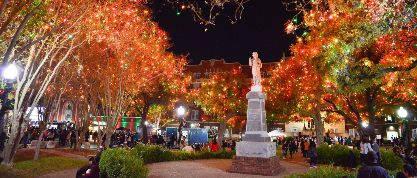 UIW statue surrounded by Christmas Lights