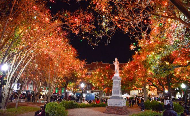 UIW statue surrounded by Christmas Lights