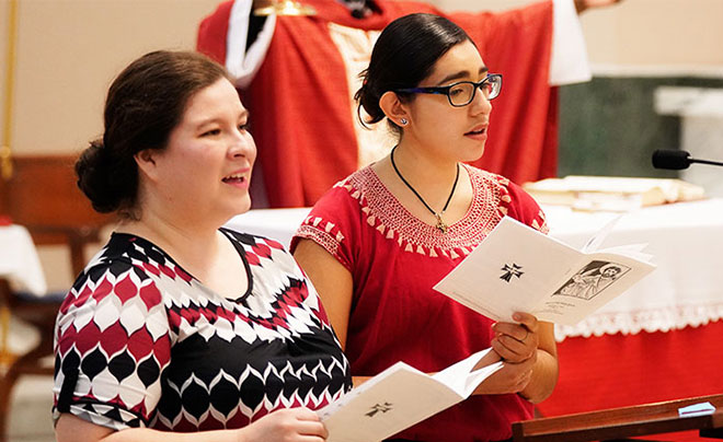 Two ladies singing in the choir