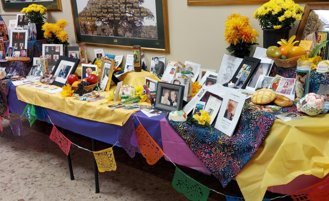 Ofrenda filled with pictures of departed loved ones