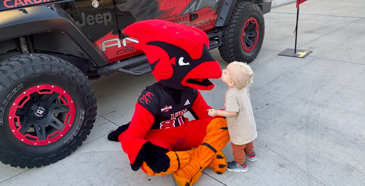 Red receives a kiss from a young fan