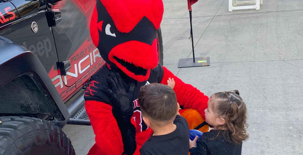 Red with two young fans