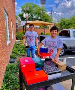 Students organizing shoe boxes