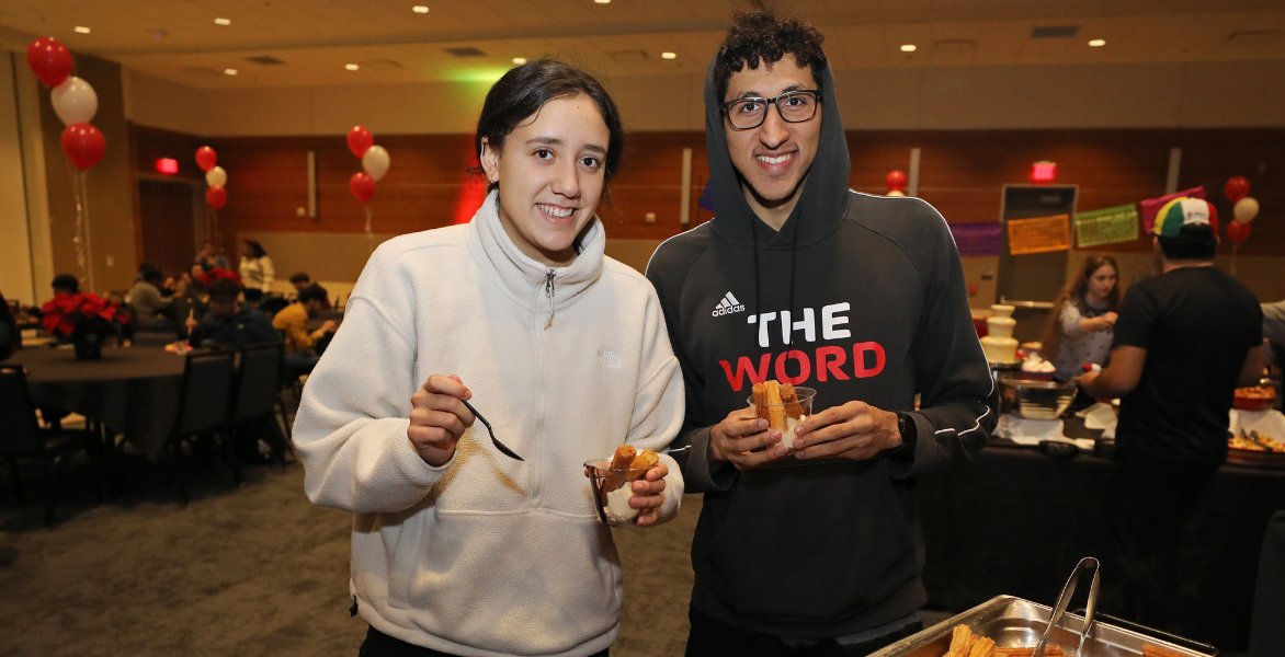 Two students getting churros