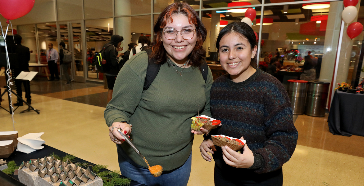 Two students getting appetizers in the SEC Concourse