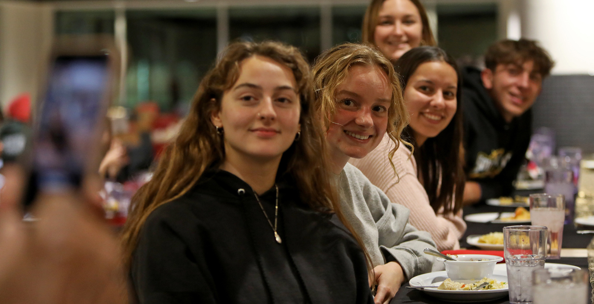 Students eating dinner together